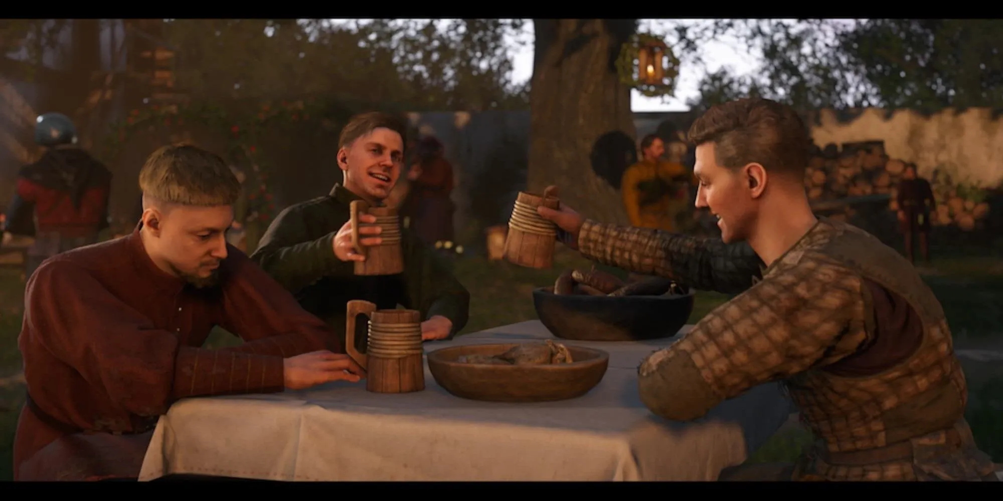 Các nhân vật đang ăn uống trong Kingdom Come Deliverance 2.