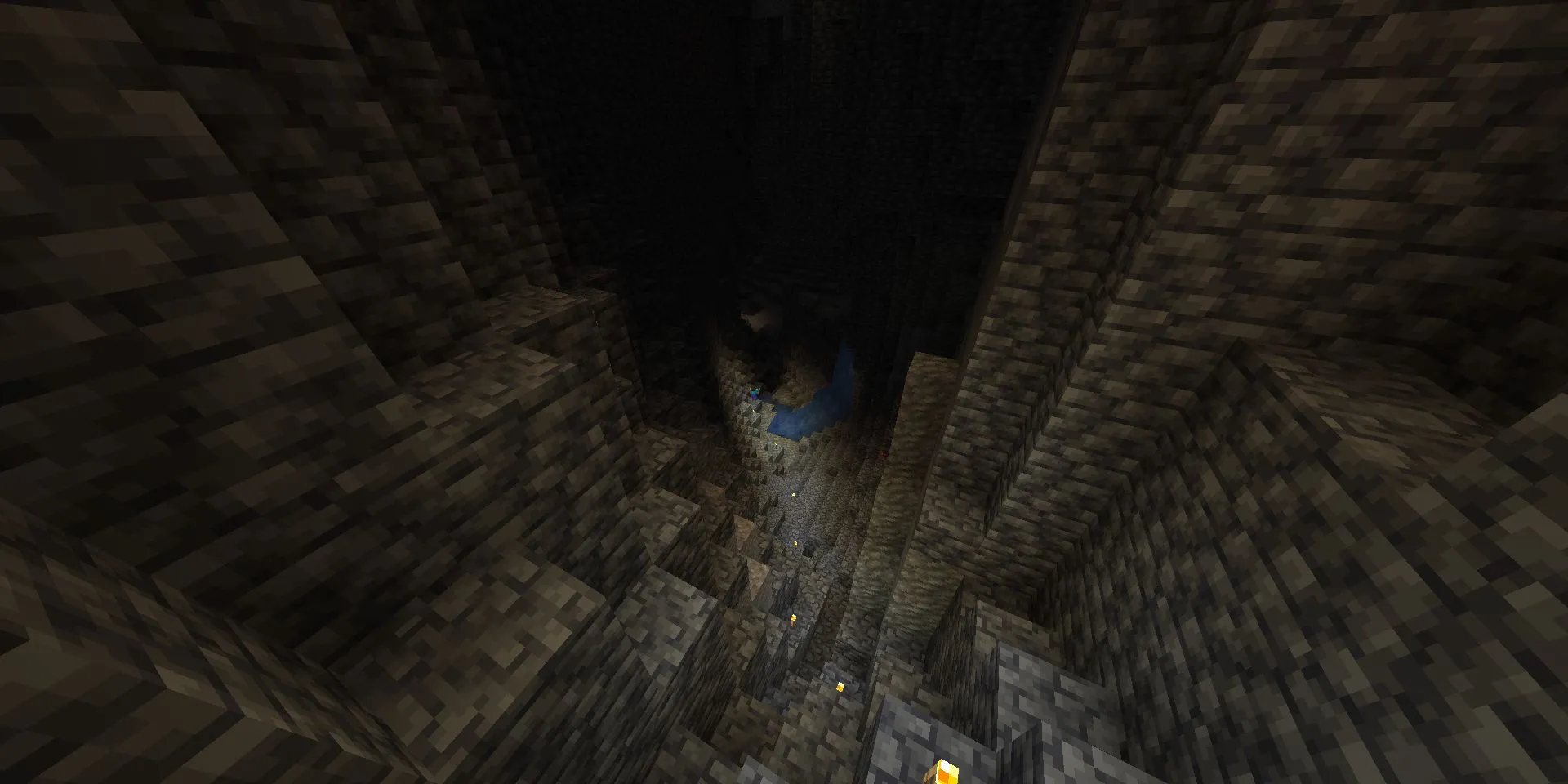 Steve khám phá hang động tối tăm với đuốc trong Minecraft