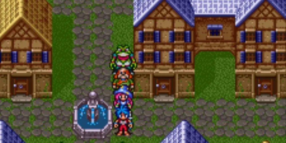 Dàn nhân vật chính bên đài phun nước trong một thị trấn yên bình của game nhập vai Breath of Fire 2